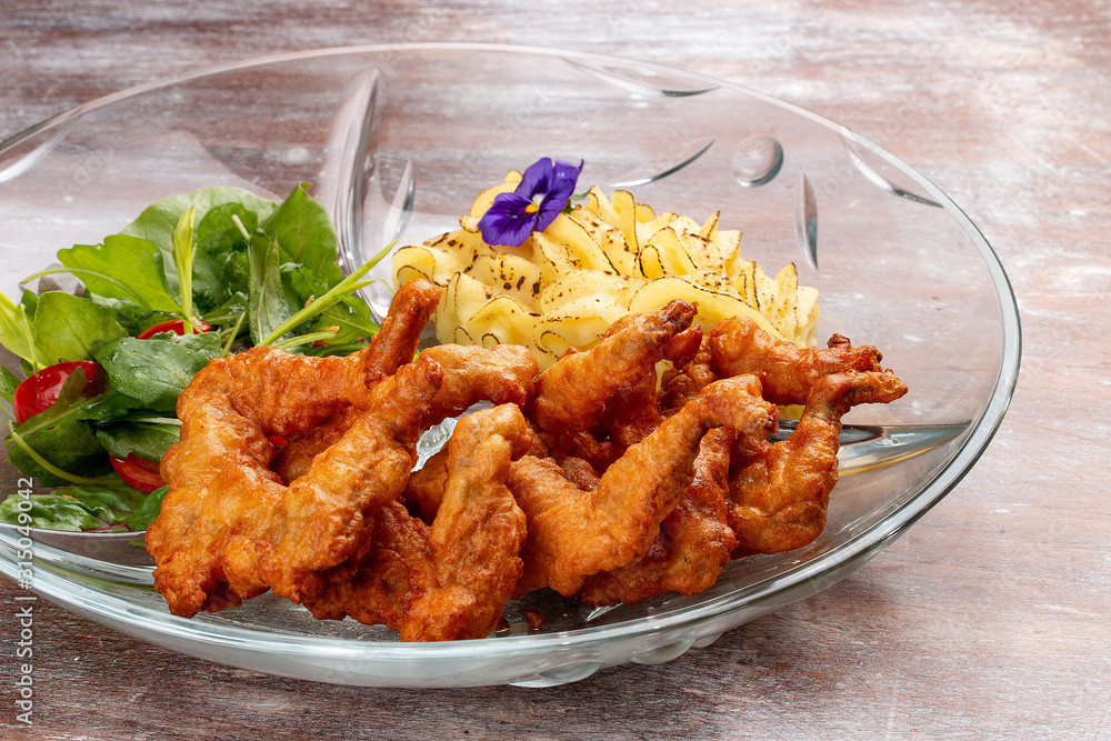 Frog legs crispy with mashed potatoes. Classic retro Russian dish Frog legs crispy with mashed potatoes. Classic retro Russian dish
