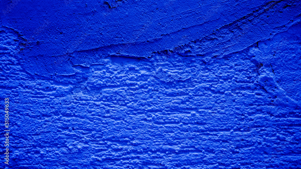 Naklejka premium Blue concrete wall covered with cement.