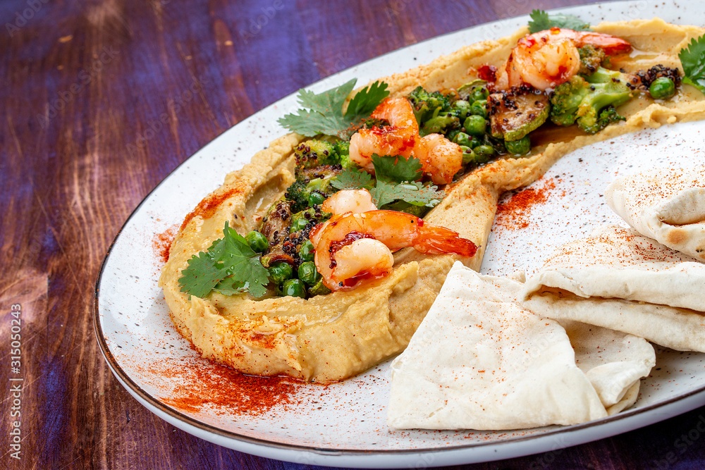 Hummus with shrimp, vegetables and homemade tortillas Hummus with shrimp, vegetables and homemade tortillas