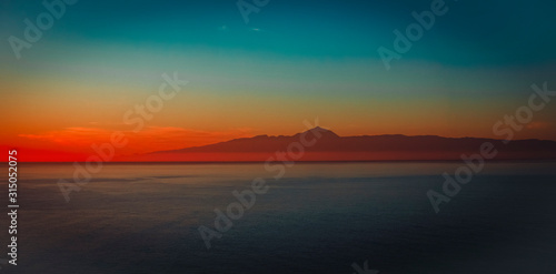 Sunset at sea in Grand Canaria with view on Teide  panorama