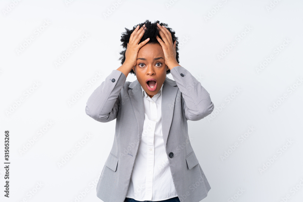 African american business woman over isolated white background with surprise facial expression African american business woman over isolated white background with surprise facial expression