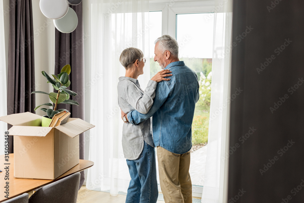 selective focus of mature man and woman dancing in new house selective focus of mature man and woman dancing in new house