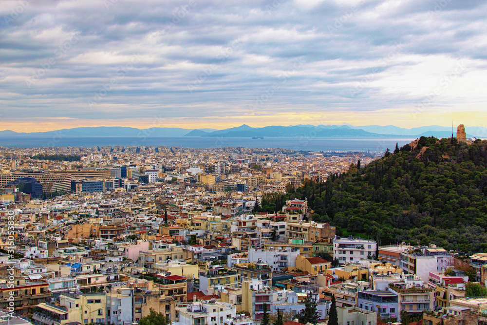Gorgeous aerial view over the city of Athens against cloudy sky. Famous touristic place and travel destination in Europe. Greece