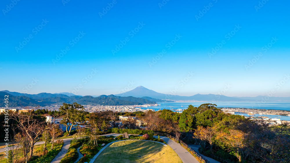 Mt. Fuji / Fuji Mountain and Shimizu Industrial Port over blue sky at Nihondaira, Shizuoka, Japan