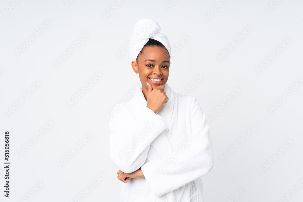 African american woman in a bathrobe over isolated background laughing African american woman in a bathrobe over isolated background laughing