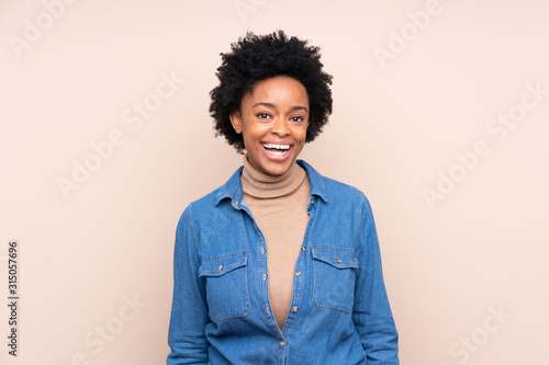 African american woman over isolated background with surprise facial expression