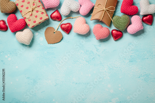 Valentine's Day background with colorful hearts and gift boxes