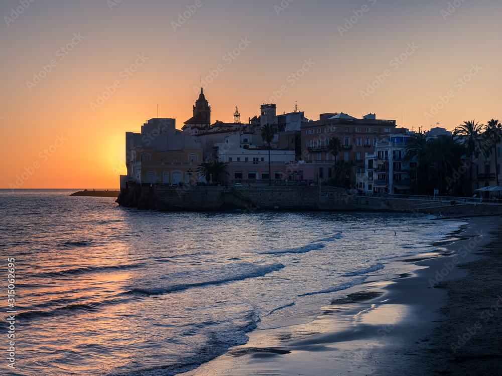 Silhouette of the church and the houses over the sea Silhouette of the church and the houses over the sea