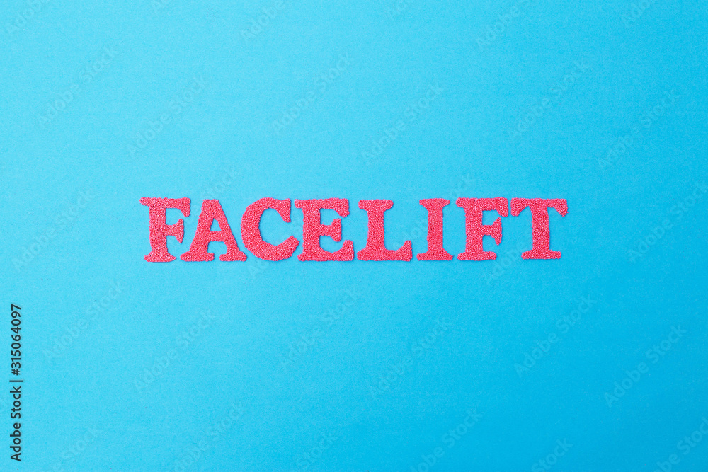 Word facelift in red letters on a blue background. Concept of modern facelift cosmetology procedure, cosmetology