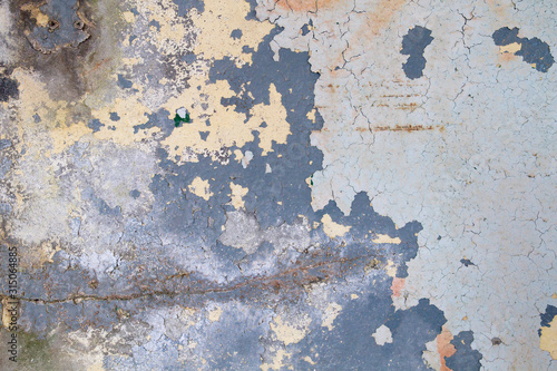 Layers of peeling paint on old wall