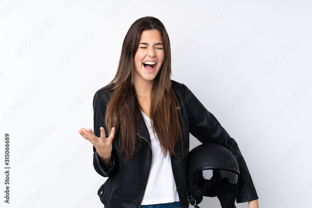 Young woman with a motorcycle helmet over isolated white background unhappy and frustrated with something Young woman with a motorcycle helmet over isolated white background unhappy and frustrated with something