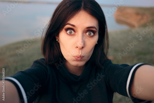 Cheerful Woman Taking a Selfie in Nature 