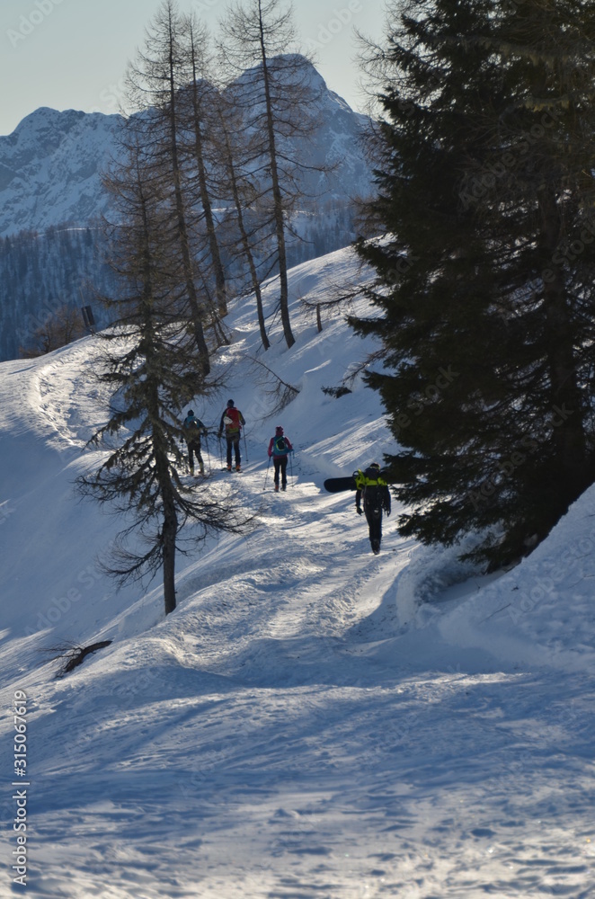 Snowshoe walker running in powder snow Snowshoe walker running in powder snow