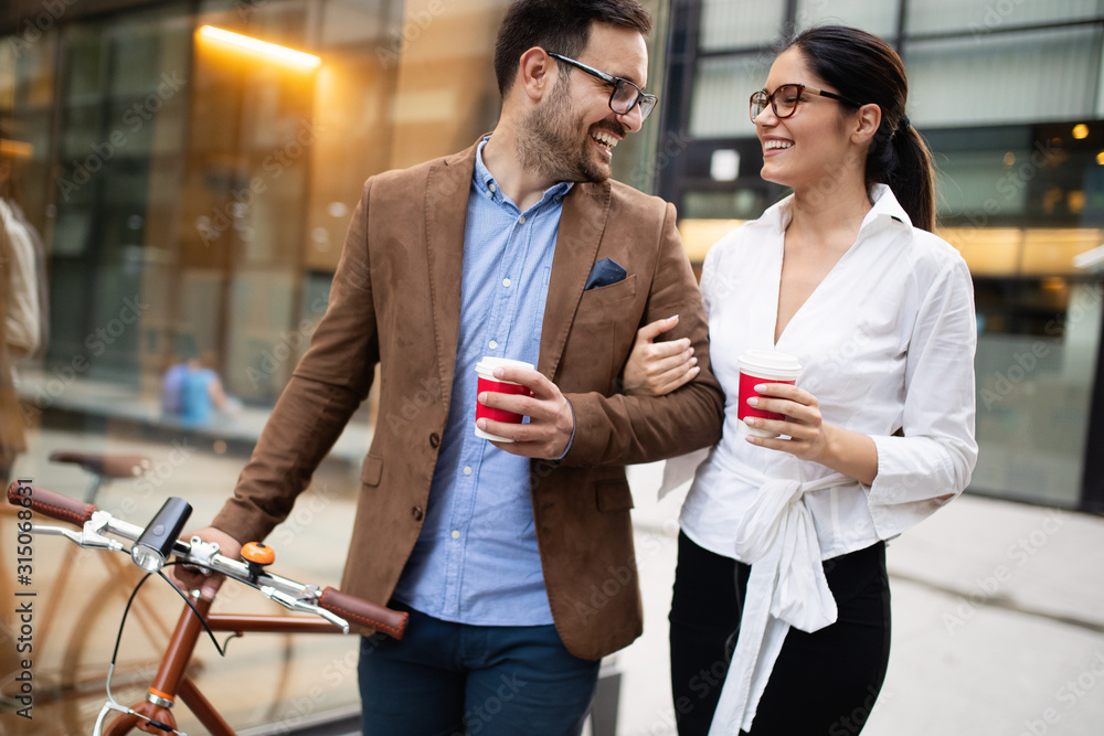Fototapeta premium Office woman with business man couple enjoying break while talking flirting outdoor