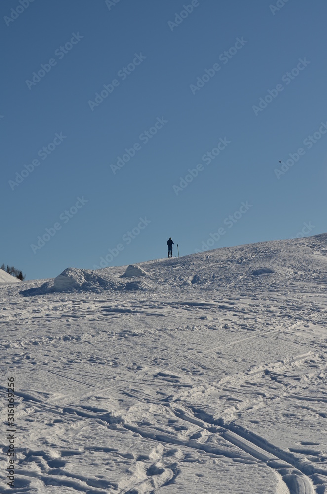 Snowshoe walker running in powder snow