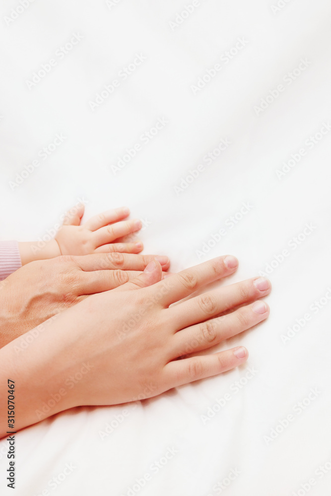 Hands of children and old woman Hands of children and old woman
