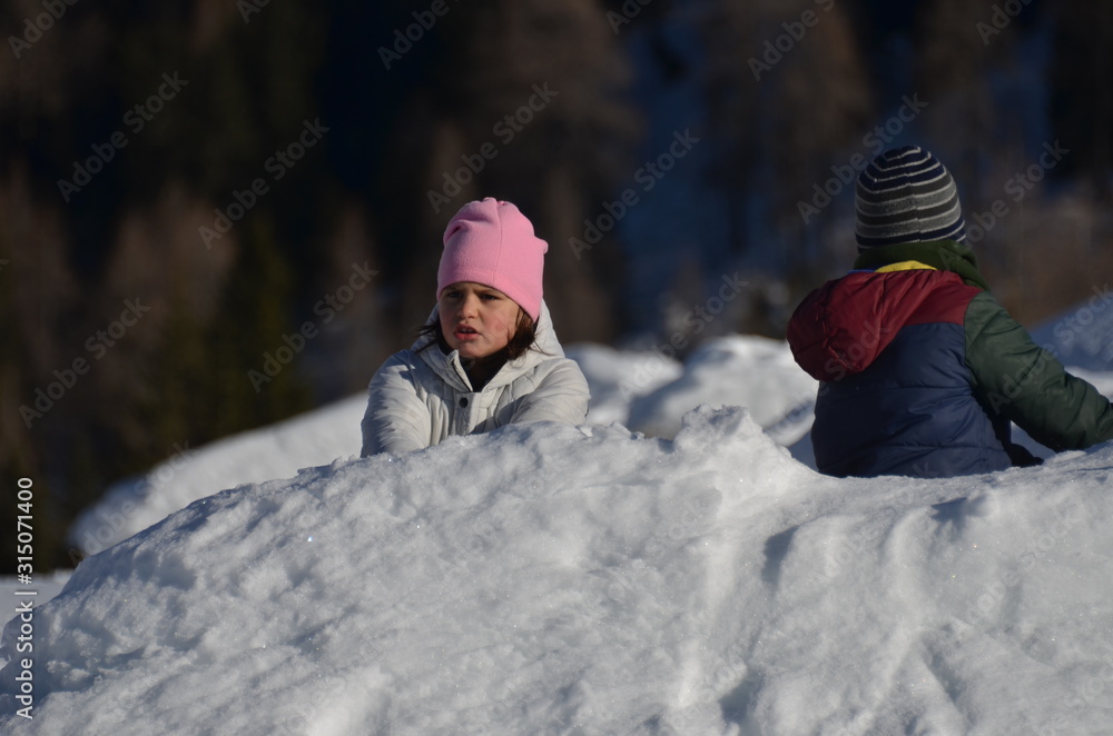 Children slide down hills 