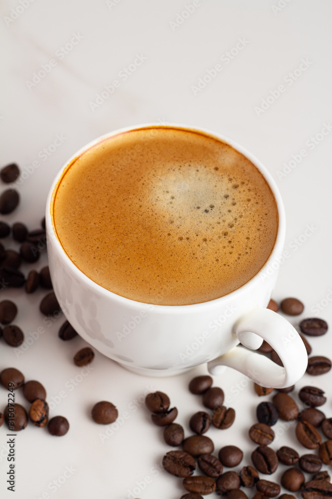 cup of coffee with beans on white background cup of coffee with beans on white background