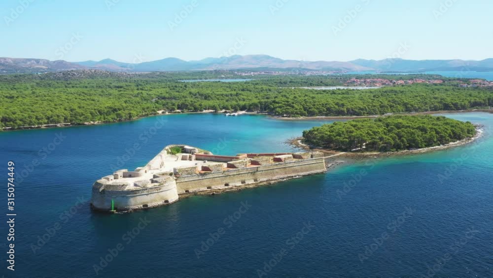 Saint Nicholas fortress at Sibenik bay entrance, Dalmatia, Croatia, drone aerial footage of beautiful blue coastline seascape Saint Nicholas fortress at Sibenik bay entrance, Dalmatia, Croatia, drone aerial footage of beautiful blue coastline seascape