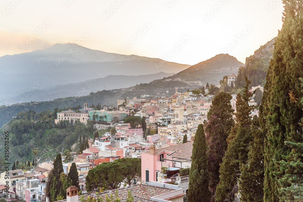 Greek reatre in Taormina Sicily, Italy, and Etna volcano in the background