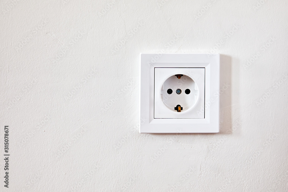 Electrical outlet socket on the white wall Electrical outlet socket on the white wall