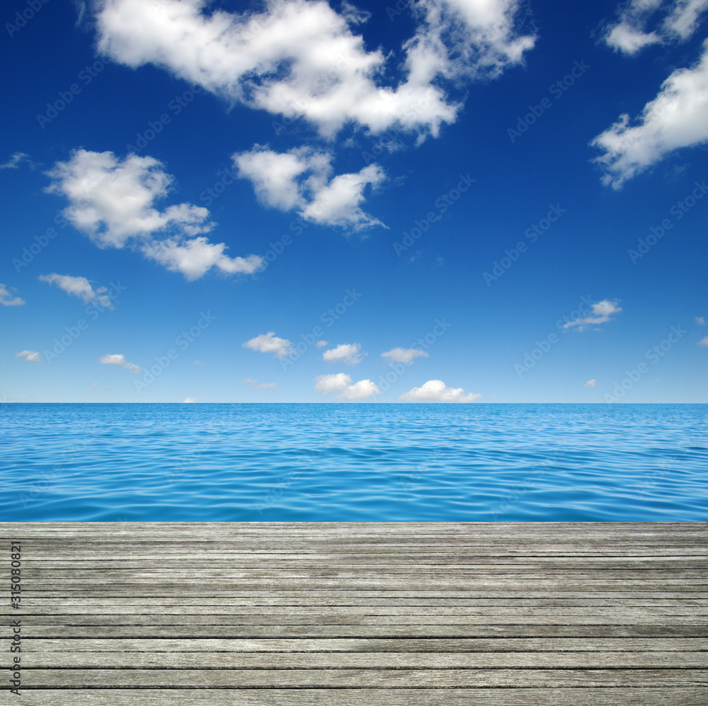 Fototapeta premium Sea water and and wooden table