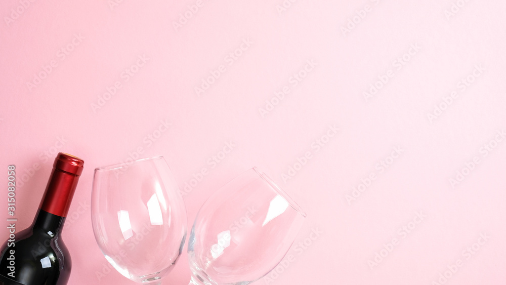 Valentines day greeting card template. Bottle of wine and glasses on pink background. Top view with copy space. Valentine's day, love, romance concept - obrazy, fototapety, plakaty 