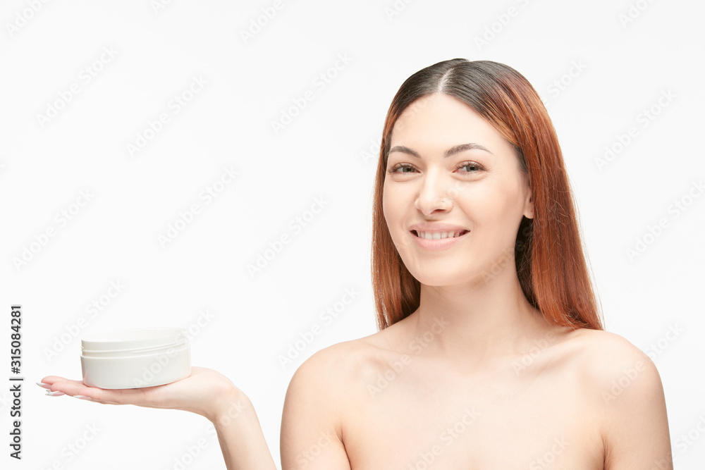 Portrait of a beautiful young woman with cream Portrait of a beautiful young woman with cream