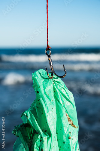 used plastic bag in a fish hook photo
