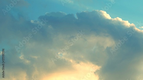 Cumulus clouds in bright blue sky, natural photo background, Blue sky and clouds at the sunset abstract background  © h.studio