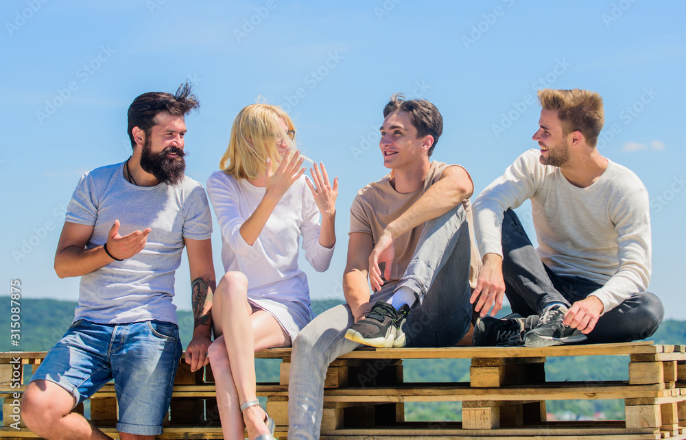 group of four people. great fit for day off. best friends. Summer vacation. diverse young people talking together. Group of people in casual wear. happy men and girl relax. Good idea