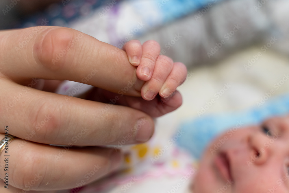 hands of a newborn baby and dad hands of a newborn baby and dad