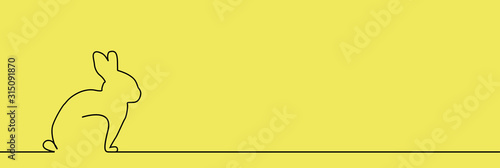 Outline of easter rabbit on the yellow