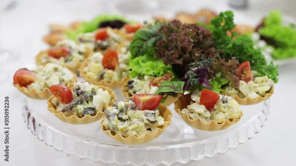 canapes laid out on a plate at the buffet table canapes laid out on a plate at the buffet table