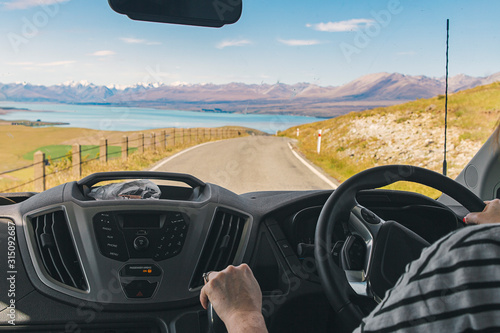 Photo of a person driving a campervan in New Zealand