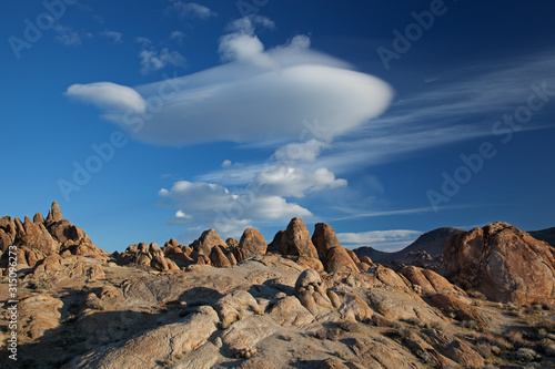 Rocky landscape of the Alabama Hills with beautiful and unique clouds near Lone Pine, California, USA