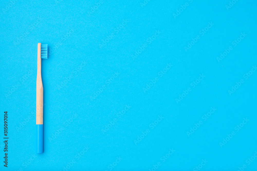 Toothbrush on blue background top view Toothbrush on blue background top view