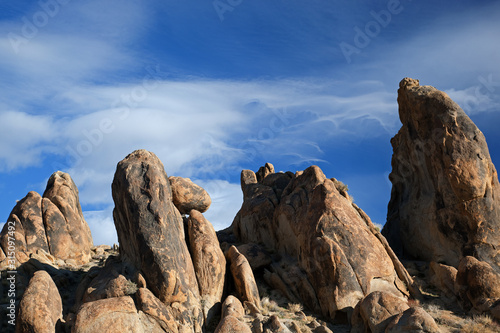 Rocky landscape of Alabama Hills with beautiful and unique clouds near Lone Pine, California, USA