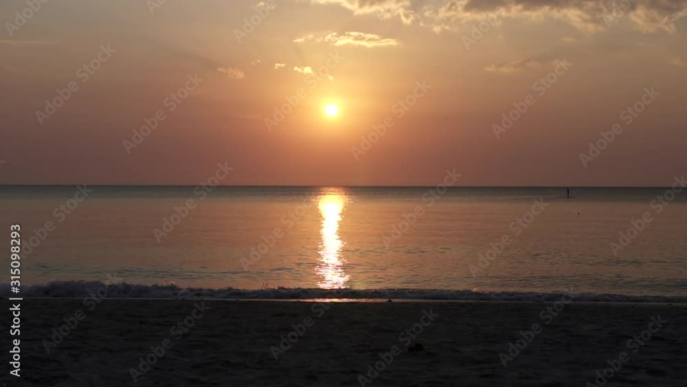 Stand Up Paddle Boards Silhouette on Water at sunset in Andaman Sea, thailand Stand Up Paddle Boards Silhouette on Water at sunset in Andaman Sea, thailand