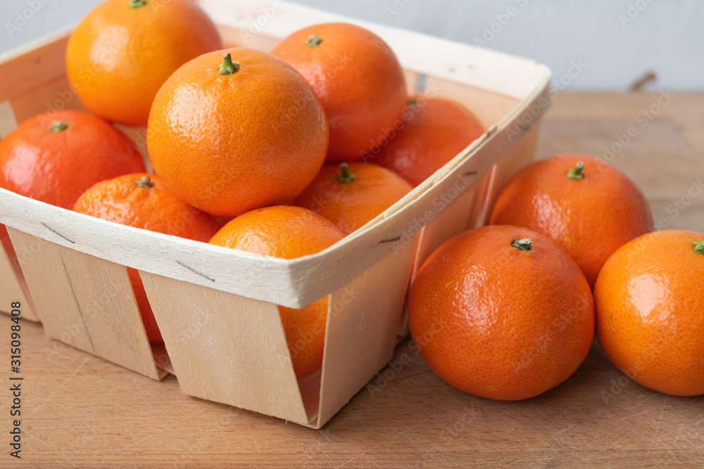 Tangerines(oranges,mandarins,clementines,citrus fruits)wooden backgrounds