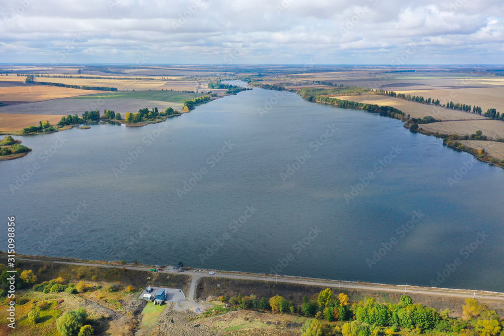 Obraz premium Reservoir. Pond. Drone arial view Ukrainian open spaces. Lakes, water