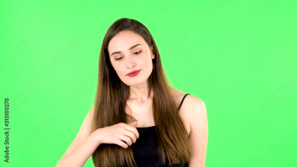 Young tired woman cooling herself by her hand, suffering from high temperature weather. Green screen Young tired woman cooling herself by her hand, suffering from high temperature weather. Green screen