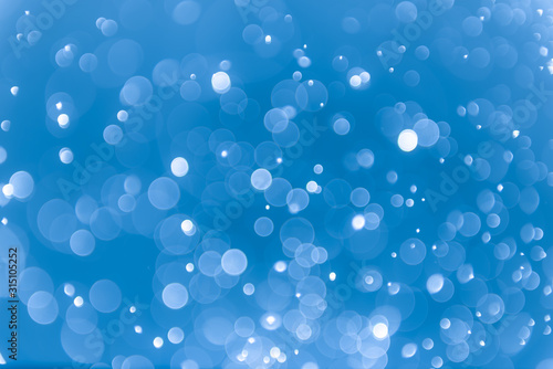Abstract blue background with bokeh, bokeh background, sparkle bokeh background © DEEP PIXEL