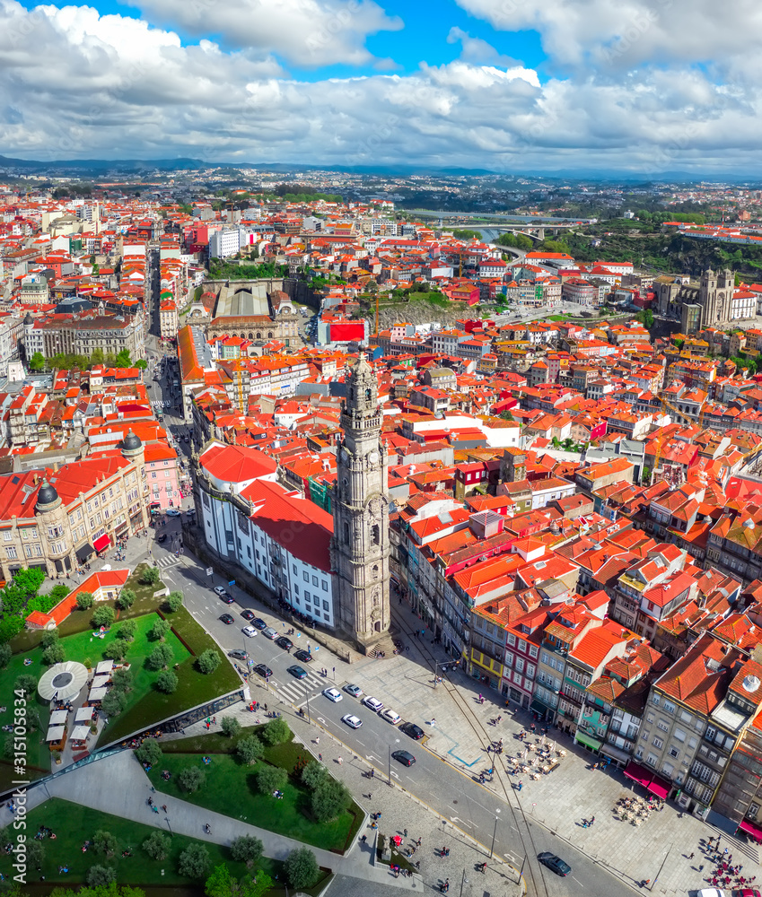 Porto Portugal vertical panorama view on historic city center catholic church or cathedral Torre dos Clerigos red roofs