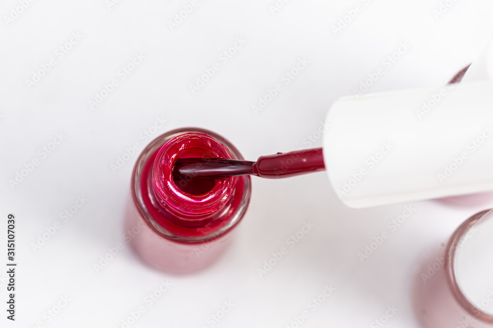 red nail polish and manicure brush with varnish red nail polish and manicure brush with varnish