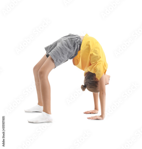 Little girl practicing yoga...