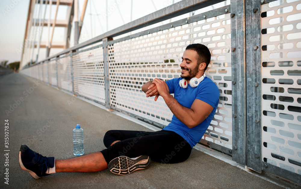Jogging. Resting after training outdoors. Fitness, sport, lifestyle concept Jogging. Resting after training outdoors. Fitness, sport, lifestyle concept