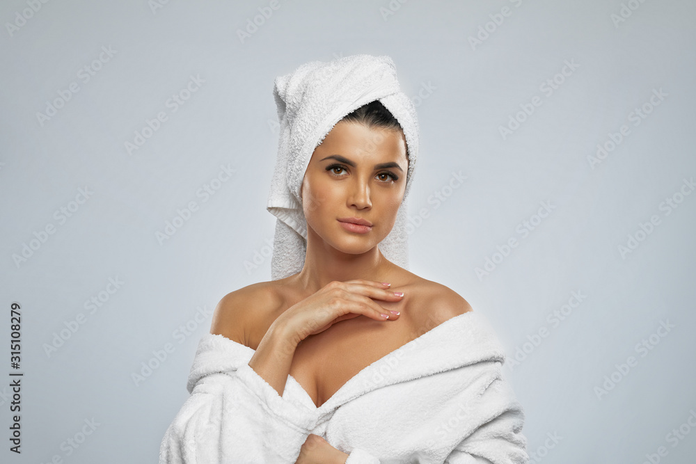 Obraz premium Woman posing in bathrobe after shower.