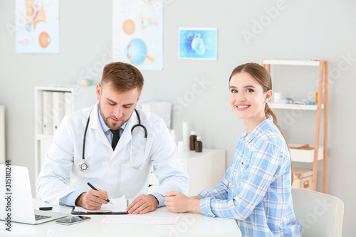 Male doctor working with fe...