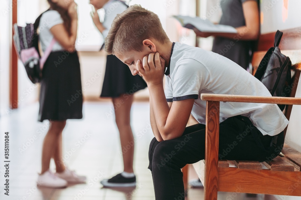 Boy sitting alone Boy sitting alone